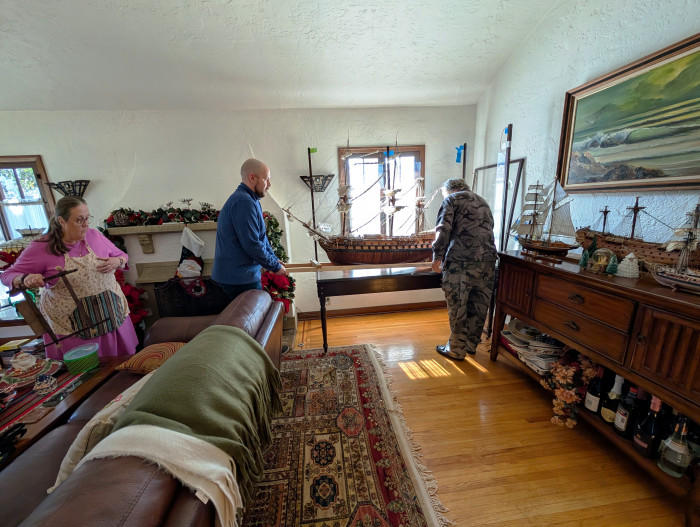 521 moving the model into its case in the living room.jpg
